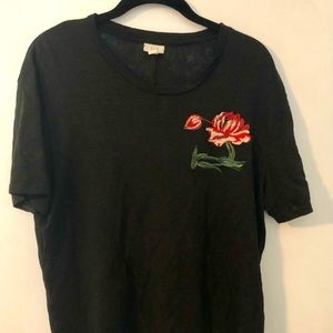 Black linen tee w/ floral embroidery and beaded detail on front. No flaws.